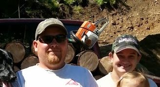 Rick Wachtel with family, splitting firewood in North Idaho